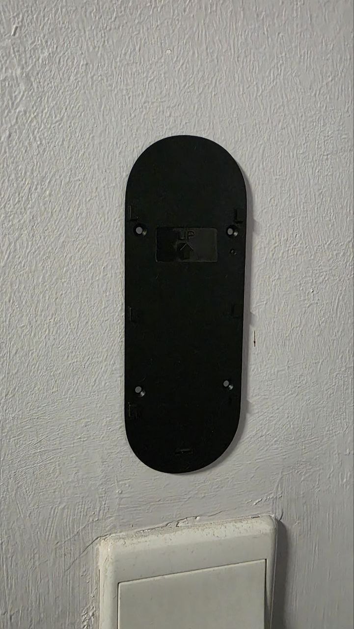 Close-up of PRISM+ Scout Doorbell installation with included screws